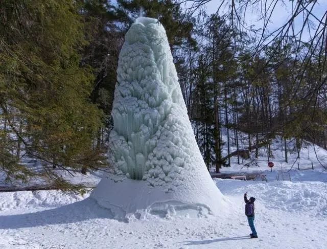 A frozen fountain resembling an ice cone