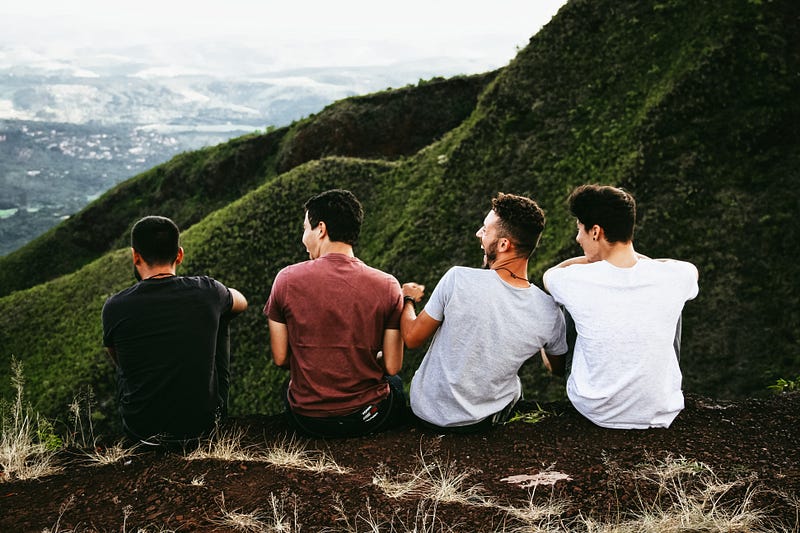 Friends laughing around a campfire